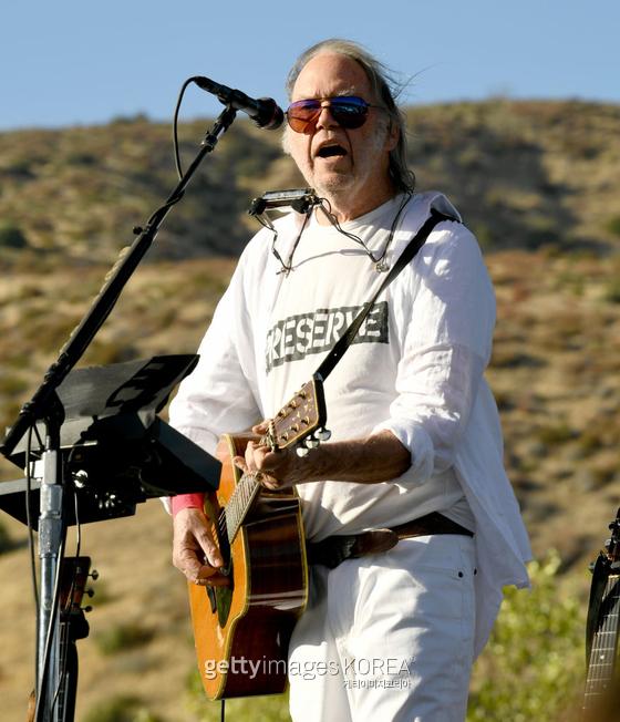 LAKE HUGHES, CALIFORNIA - SEPTEMBER 14: Neil Young performs at Harvest Moon: A Gathering to benefit The Painted Turtle and The Bridge School at Painted Turtle Camp on September 14, 2019 in Lake Hughes, California. (Photo by Kevin Winter/Getty Images)