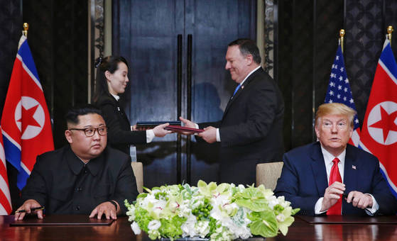 At the Capella Hotel on Sentosa Island, Singapore, where the first summit between the United States and North Korea was held on June 12, 2018, North Korea's First Vice President Kim Yeo-jeong and Secretary of State of The United States, Mike Pompeo, exchanged a joint agreement signed by President Kim Jong-un and President Donald Trump. [싱가포르 통신정보부 제공=연합뉴스] 