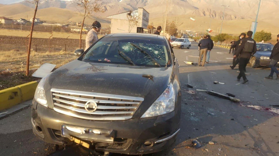 Debris is strewn on the road to Absard, a small town near Tehran, where Parc Lizade died on the 27th. The attacked vehicle was shot through the windshield.  Before the shooting, an explosive also exploded from a truck near the road. [로이터=연합뉴스]